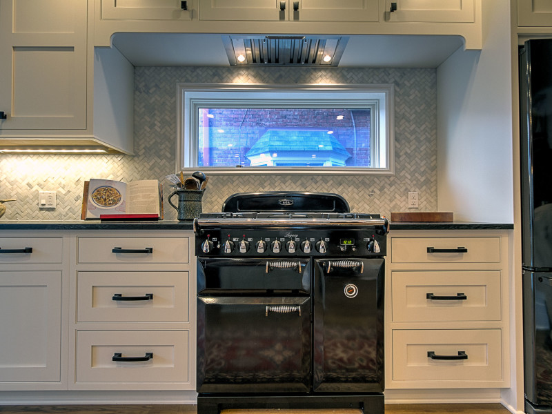 kitchen-white-cabinets-aga-legacy-herringbone-backsplash