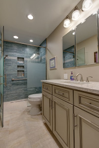 aging in place bathroom-blue tile-curbless shower-frosted shower glass