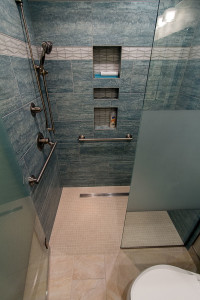 aging in place bathroom-blue tile-curbless shower-line drain