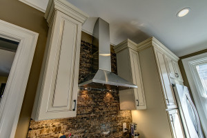 traditional-kitchen-remodel-ivory-cabinets-granite-exposed-brick