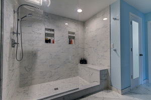 white tile-marble look tile-shower niche-shower glass