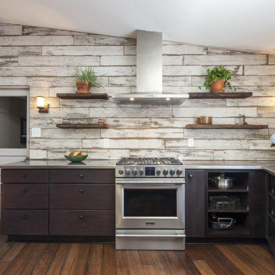 kitchen remodel-wood look tile-accent wall-dark wood cabinets-skylight-wood floors