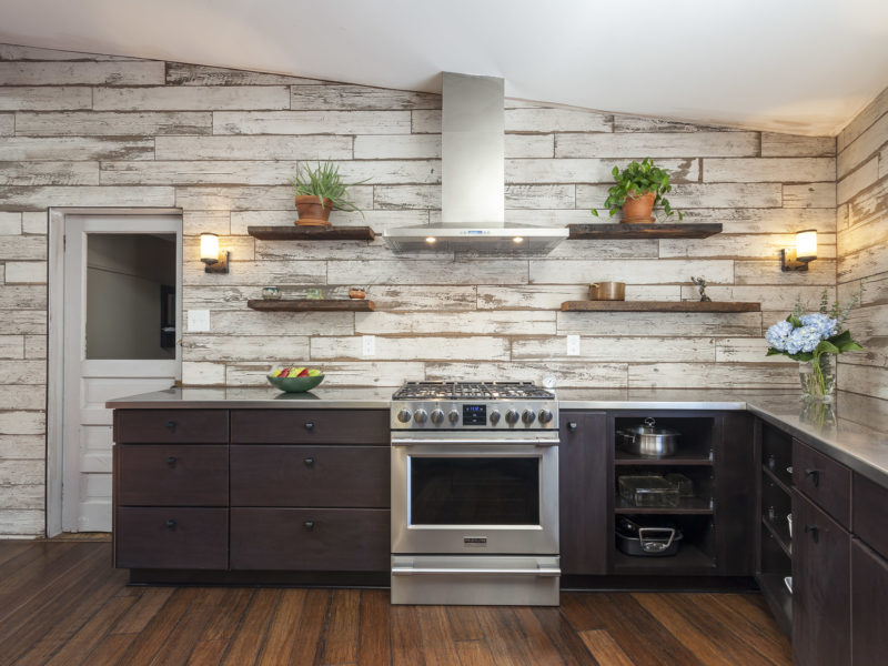 kitchen remodel-wood look tile-accent wall-dark wood cabinets-skylight-wood floors