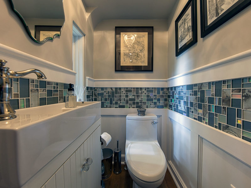 bathroom remodel-powder room-blue tile-glass tile-narrow sink-small powder room-wainscot paneling