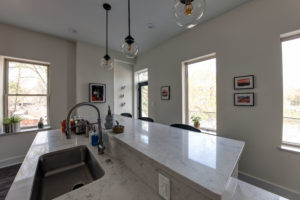 kitchen remodel-kitchen island-quartz marble countertops-single basin sink-pendant lights