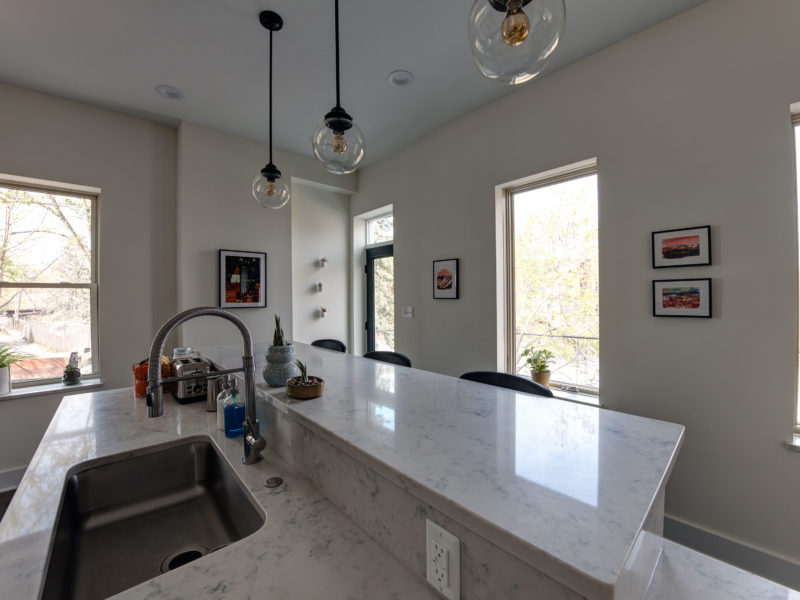 kitchen remodel-kitchen island-quartz marble countertops-single basin sink-pendant lights