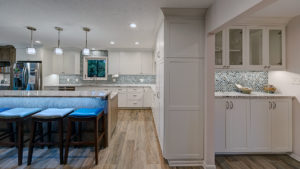 kitchen-remodel-white-cabinets-wood-look-tile-glass-backsplash