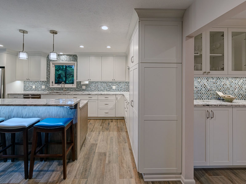 kitchen-remodel-white-cabinets-wood-look-tile-glass-backsplash