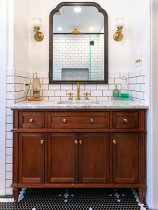 Photo of a newly remodeled bathroom with black and white tile.
