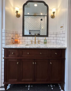 Photo of a newly remodeled bathroom with black and white tile.