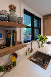 Close up of floating shelves in a newly remodeled kitchen.