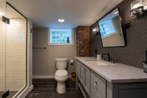 Beautifully remodeled bathroom in a finished basement in Pittsburgh.