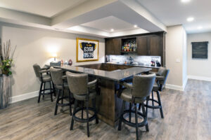 Photo of the bar area in a large, beautifully finished basement in Pittsburgh.
