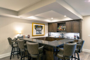 Photo of a Steelers-themed bar area in a large, beautifully finished basement in Pittsburgh.