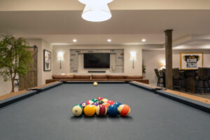 Close up of the pool table in a finished basement in Pittsburg.