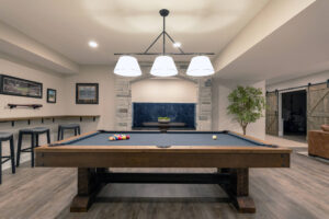View of a pool table in a finished basement in Pittsburg.