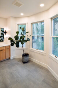 View of the bay windows in a newly expanded bathroom with tons of natural light.