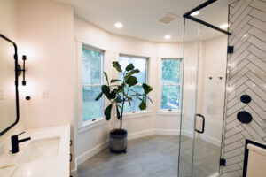 View of the bay windows in a newly expanded bathroom with tons of natural light.