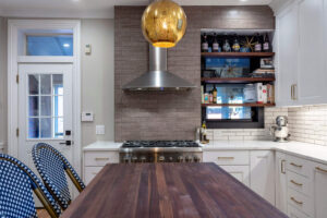 Close up of the dark wood countertop on the island in a newly remodeled kitchen.