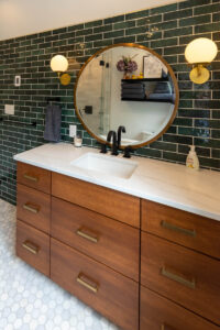 View of the wood vanity in a newly remodeled bathroom.