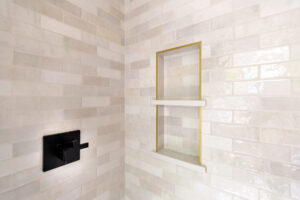 Close up of the niche in a custom tiled shower in a newly remodeled bathroom in Pittsburgh.
