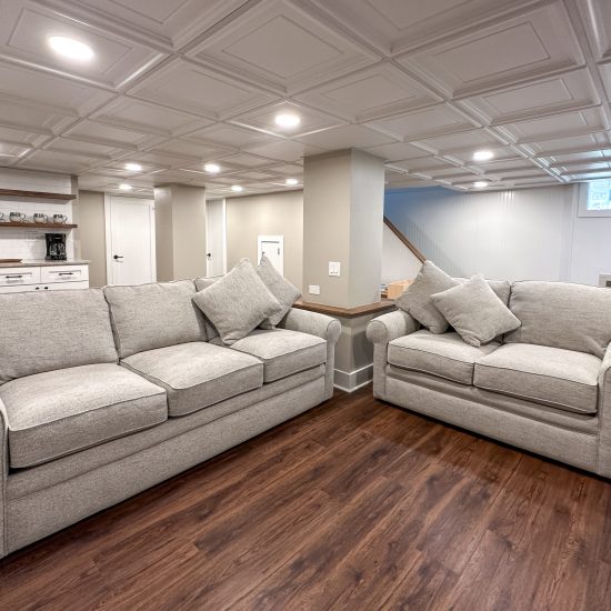 New family room with seating area created during a full basement renovation.