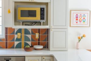Close up view of the retro yellow microwave in a kitchen that was part of a first floor renovation in Pittsburgh.