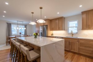 Alt view of a beautiful kitchen renovation in Mt. Lebanon featuring marble countertops and a neutral color palette.