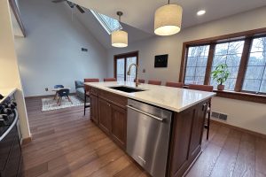 Chief's view from inside of an open concept kitchen with the family room in the background.