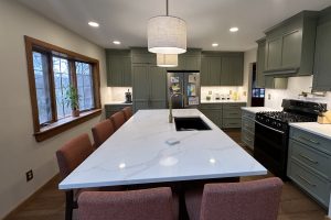 View of the large White Island countertop in a remodeled kitchen.