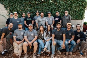 Photo of PRC Team in Front of an Ivy Covered Wall.