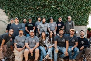 Photo of PRC Team in Front of an Ivy Covered Wall.
