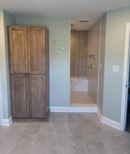 View looking into a spa-like custom tiled shower from the main bathroom area.
