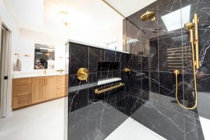 View of a newly remodeled master bathroom from within the walk-in shower.